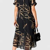 Vestido Negro con Estampado Abstracto en Oro y Escote en V