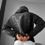 Sudadera oversize con capucha de estampado ornamental – Negro y antracita