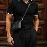 Polo de punto a rayas de corte regular – Negro