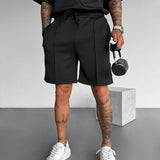 Pantalón corto de tejido técnico con costuras – Negro