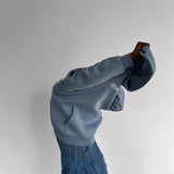 Sudadera oversize con capucha Souvenir – Denim lavado