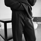 Pantalón de tejido técnico de corte holgado – Negro