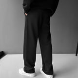 Pantalón de tejido técnico de corte holgado – Negro