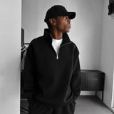 Sudadera oversize tipo polo con media cremallera – Negro