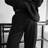Pantalón de tejido técnico de corte holgado – Negro