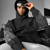 Sudadera oversize con capucha de estampado ornamental – Negro y antracita