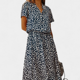 Vestido Midi de Lunares con Cuello Camisero y Cintura Ajustable