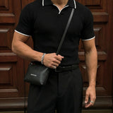 Polo de punto a rayas de corte regular – Negro